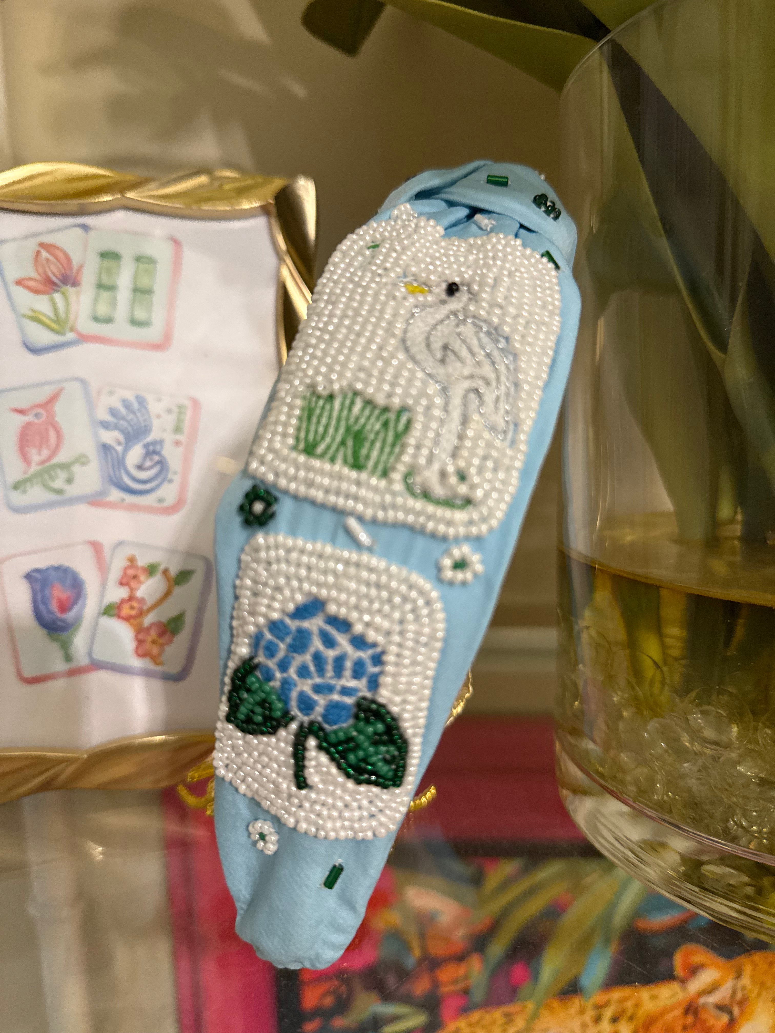 Light blue Nantucket Mahjong beaded headband featuring hand-beaded whale, hydrangea flower, and bamboo tile motifs.