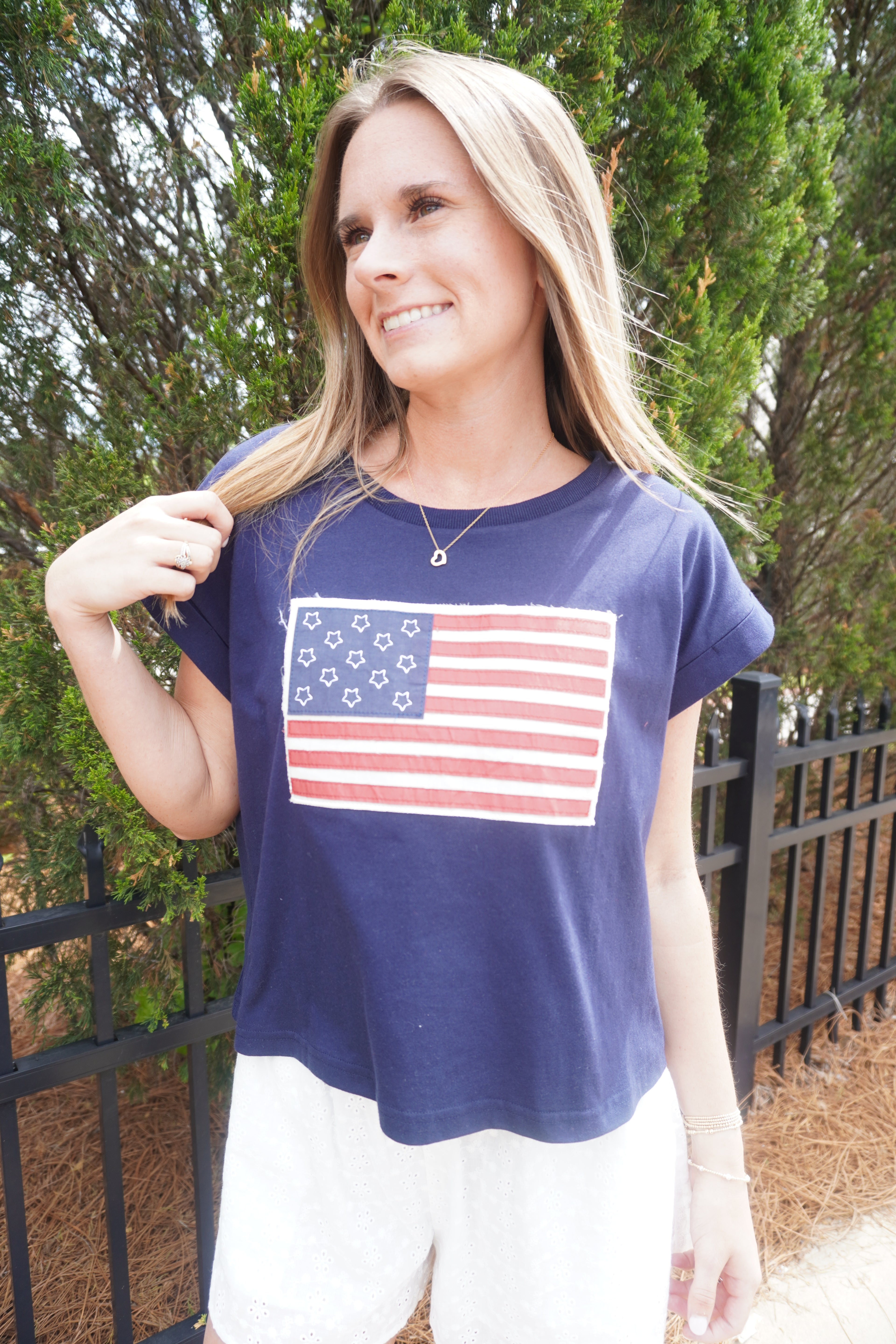 Women’s navy cropped flag tee with vintage inspired American flag graphic