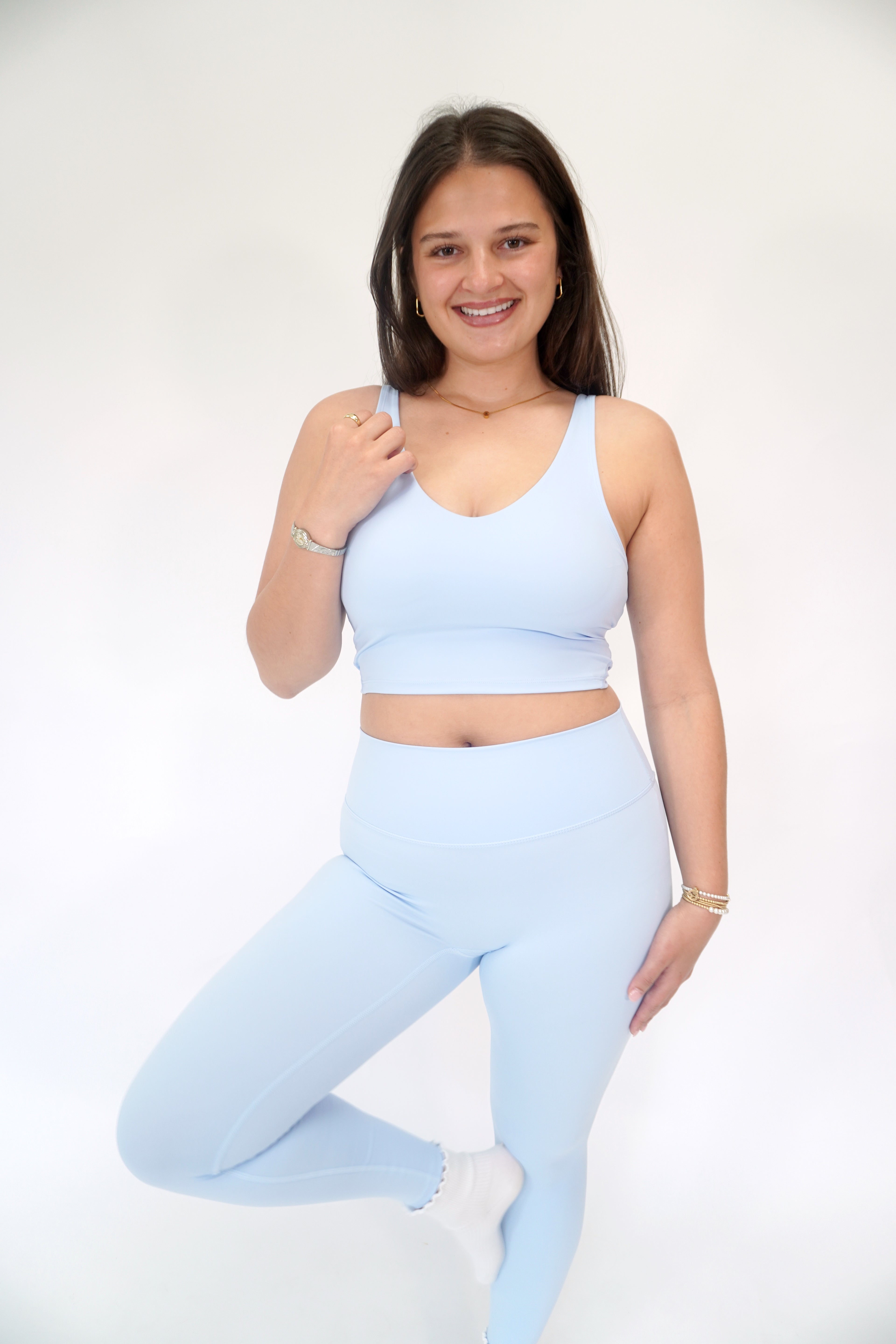 Sky blue butter-soft athletic bra with scoop neckline and comfortable activewear design.