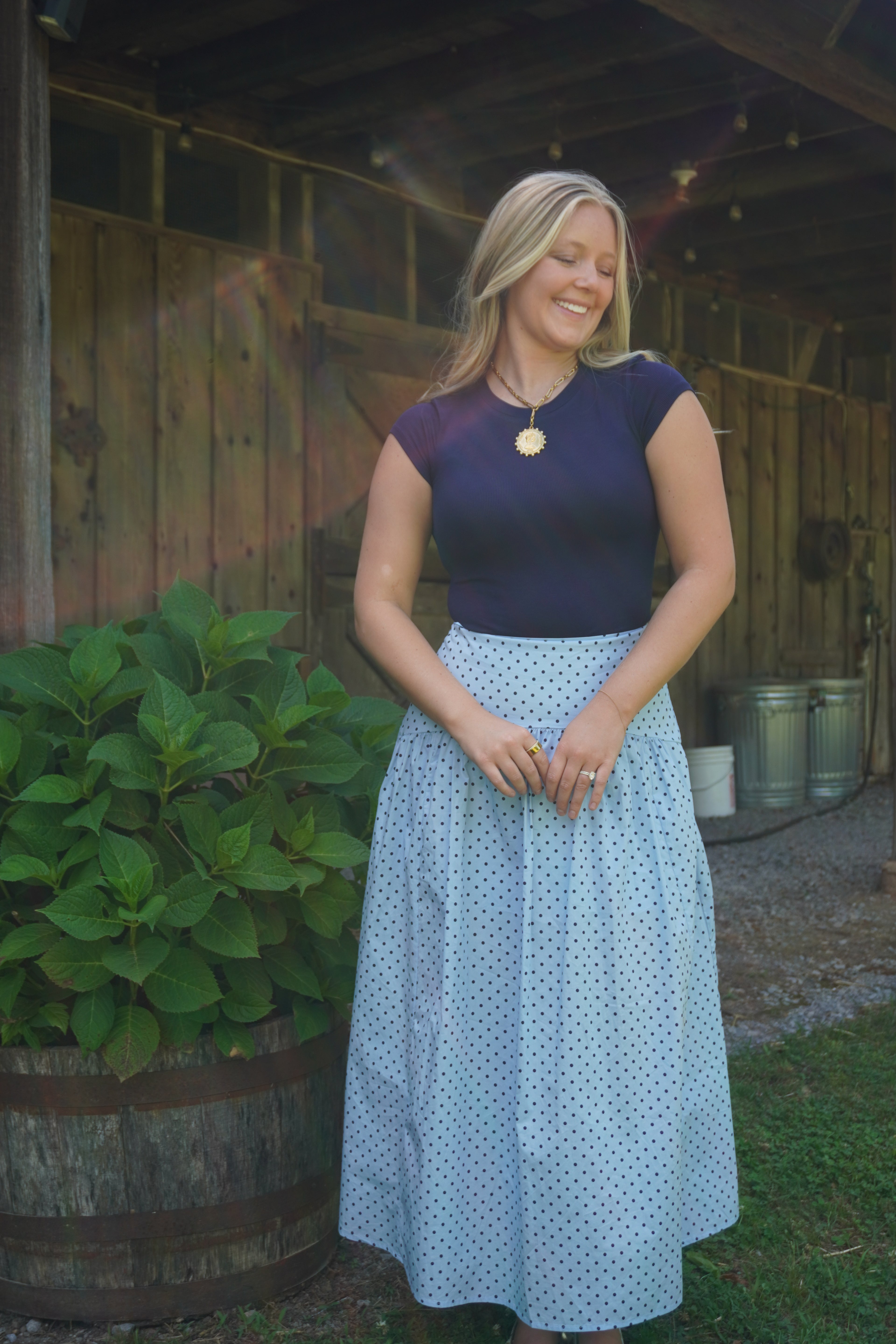 Chic light blue maxi skirt with navy micro polka dots and breezy flowy movement for effortless summer outfits