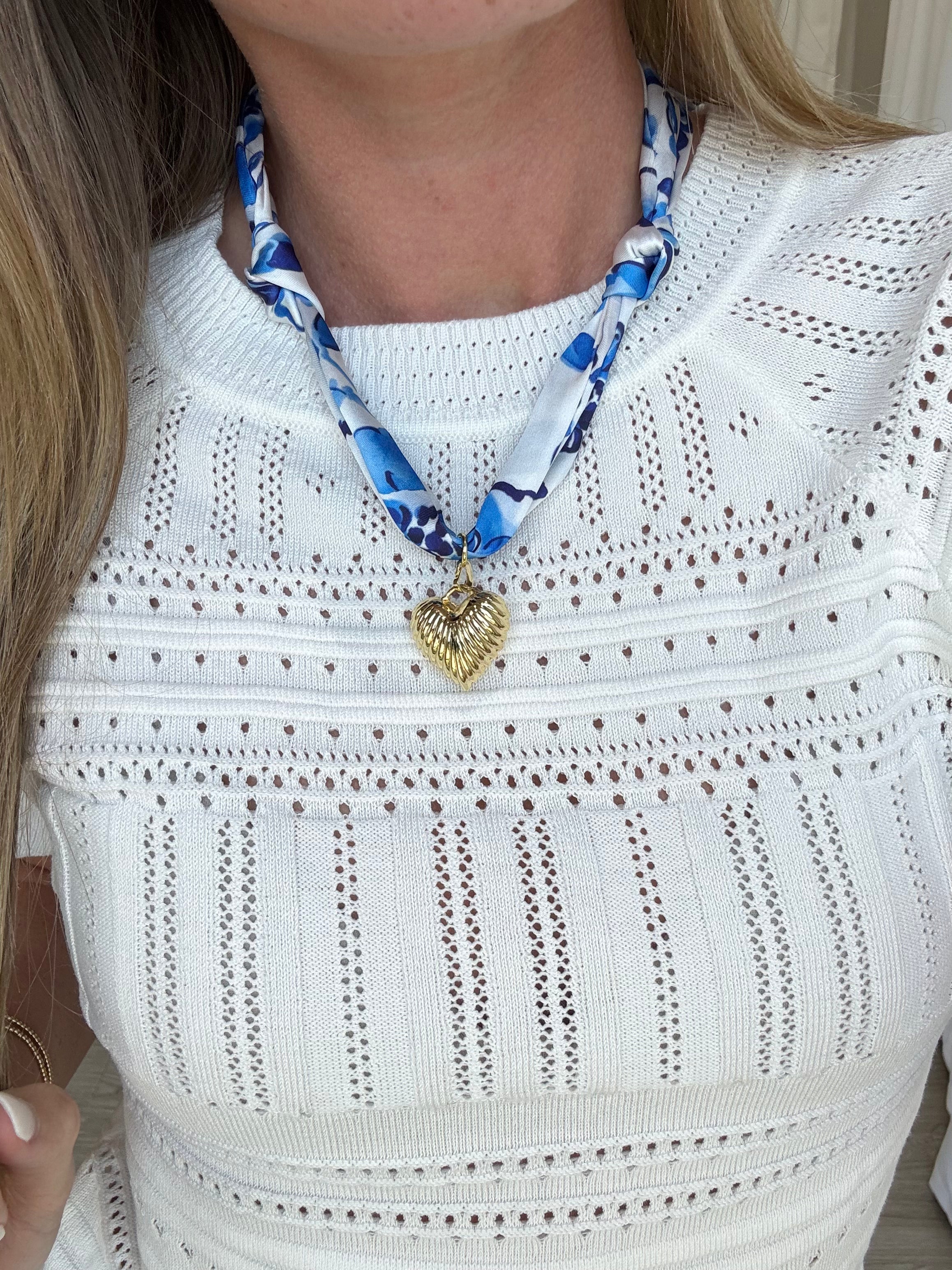 Fashion scarf necklace in orange and blue featuring a delicate gold heart charm, perfect for adding a pop of color to outfits