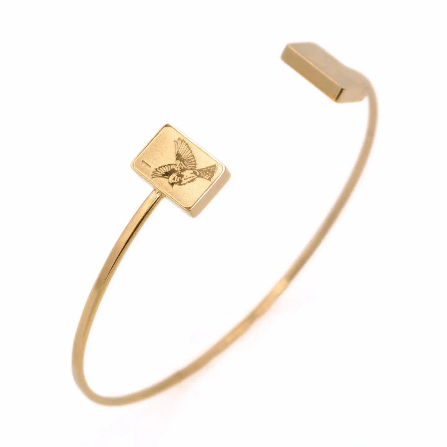 Gold mahjong bangle bracelet featuring double sparrow tile details inspired by the 1 Bam mahjong tile.