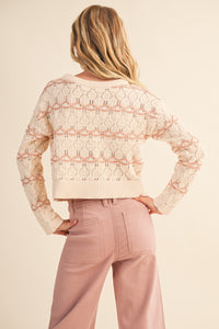Flat lay of tween cream striped open-knit sweater – lightweight knitwear