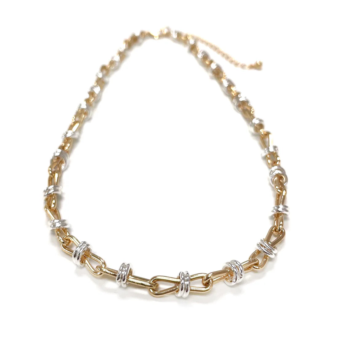 Gold and silver chain necklace on a white background