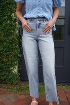 Light wash high-rise wide leg jeans with a cropped length and clean hem.