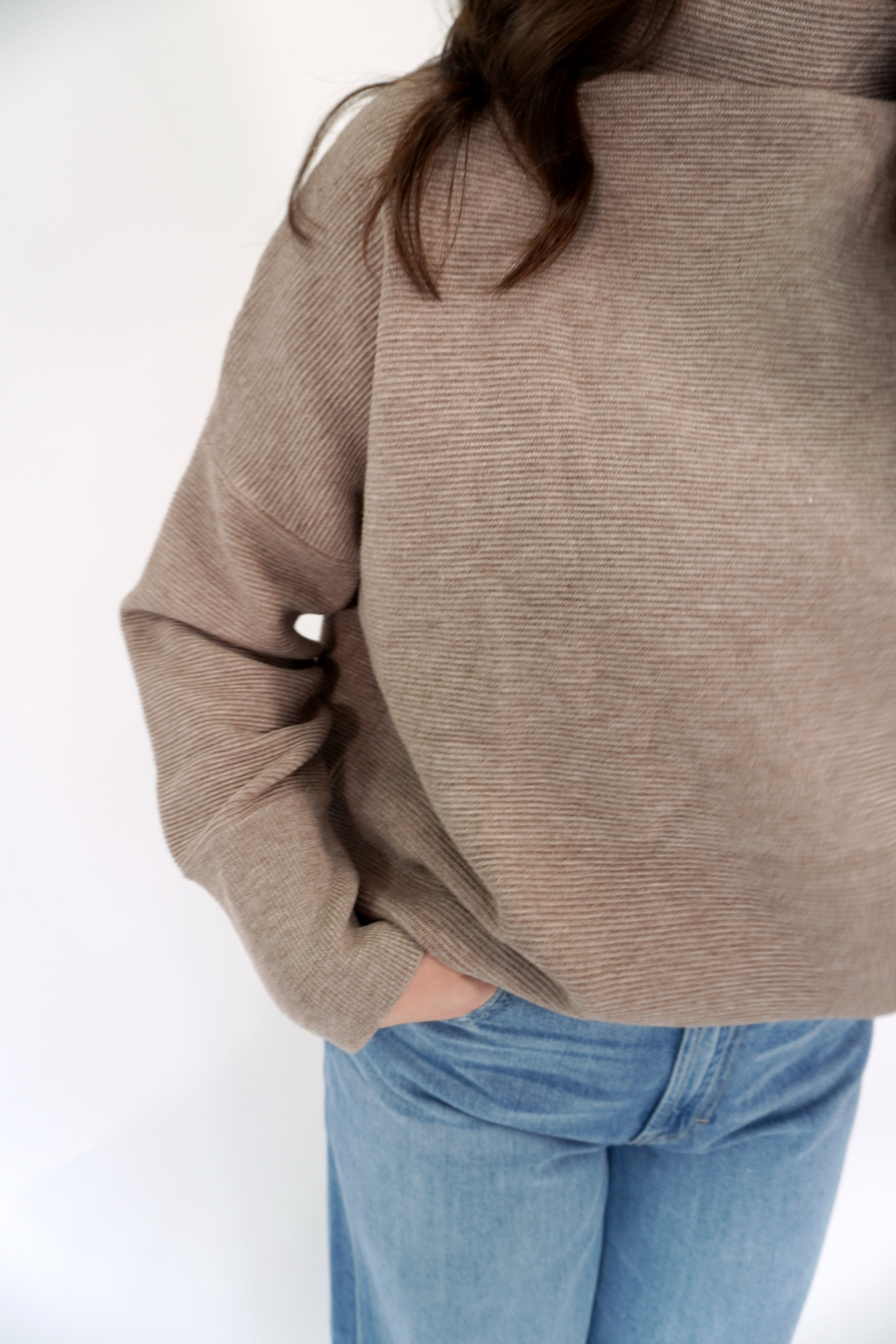 Faith-based pink sweatshirt with oversized fit and bold WWJD graphic
