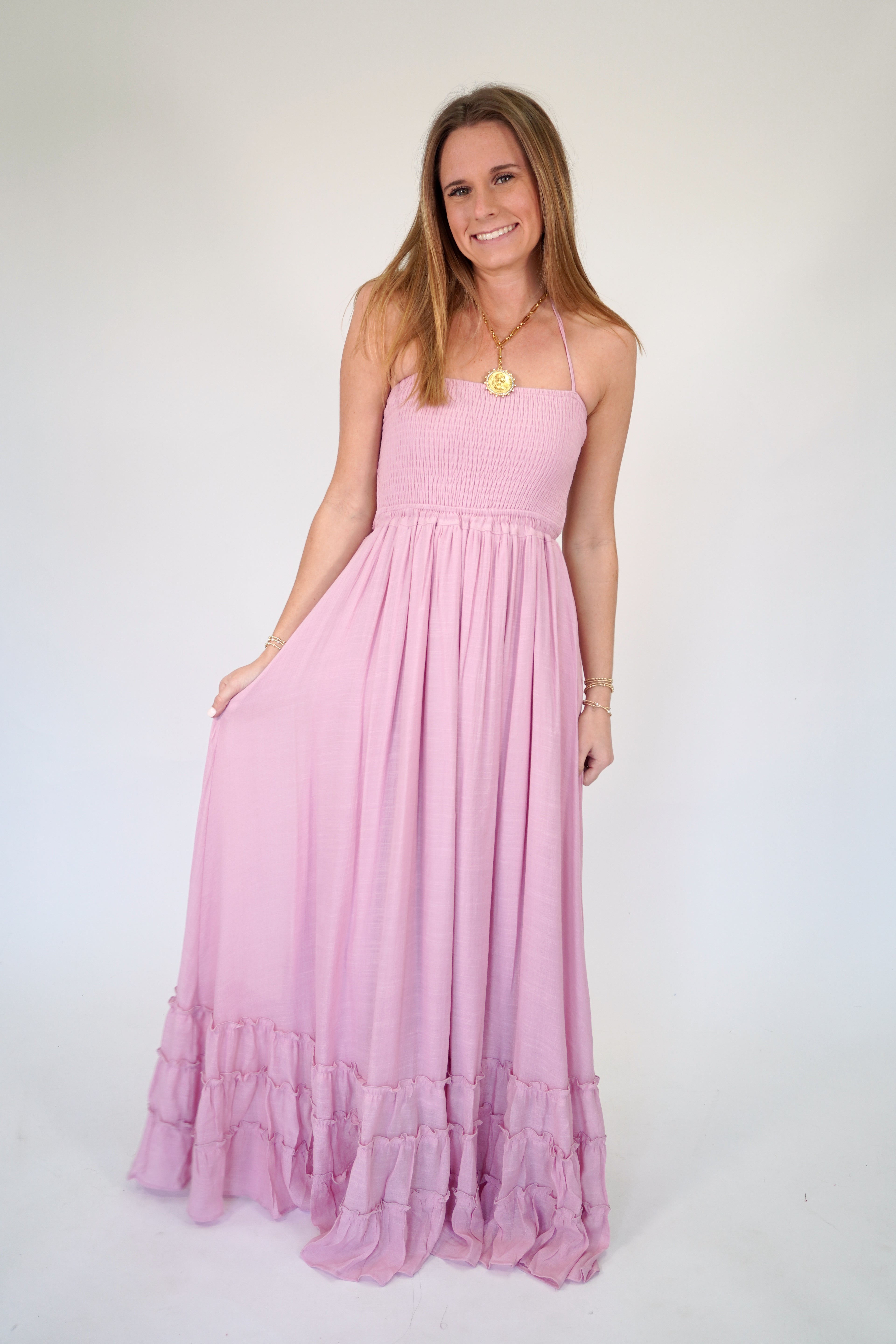Romantic blush tiered maxi dress with fitted smocked top and flowy skirt
