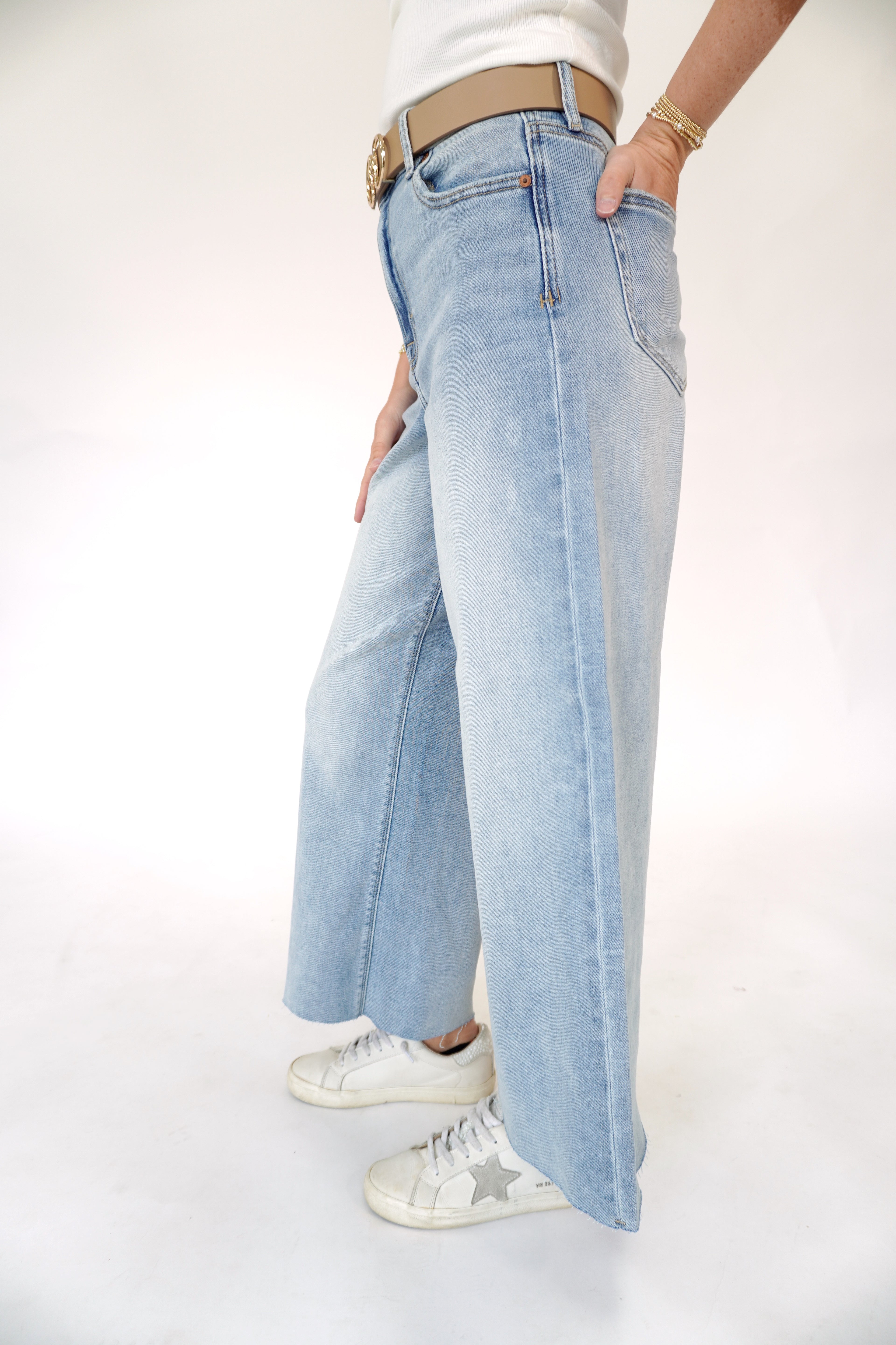 Hidden cropped wide leg jeans in light wash denim with relaxed straight leg fit.