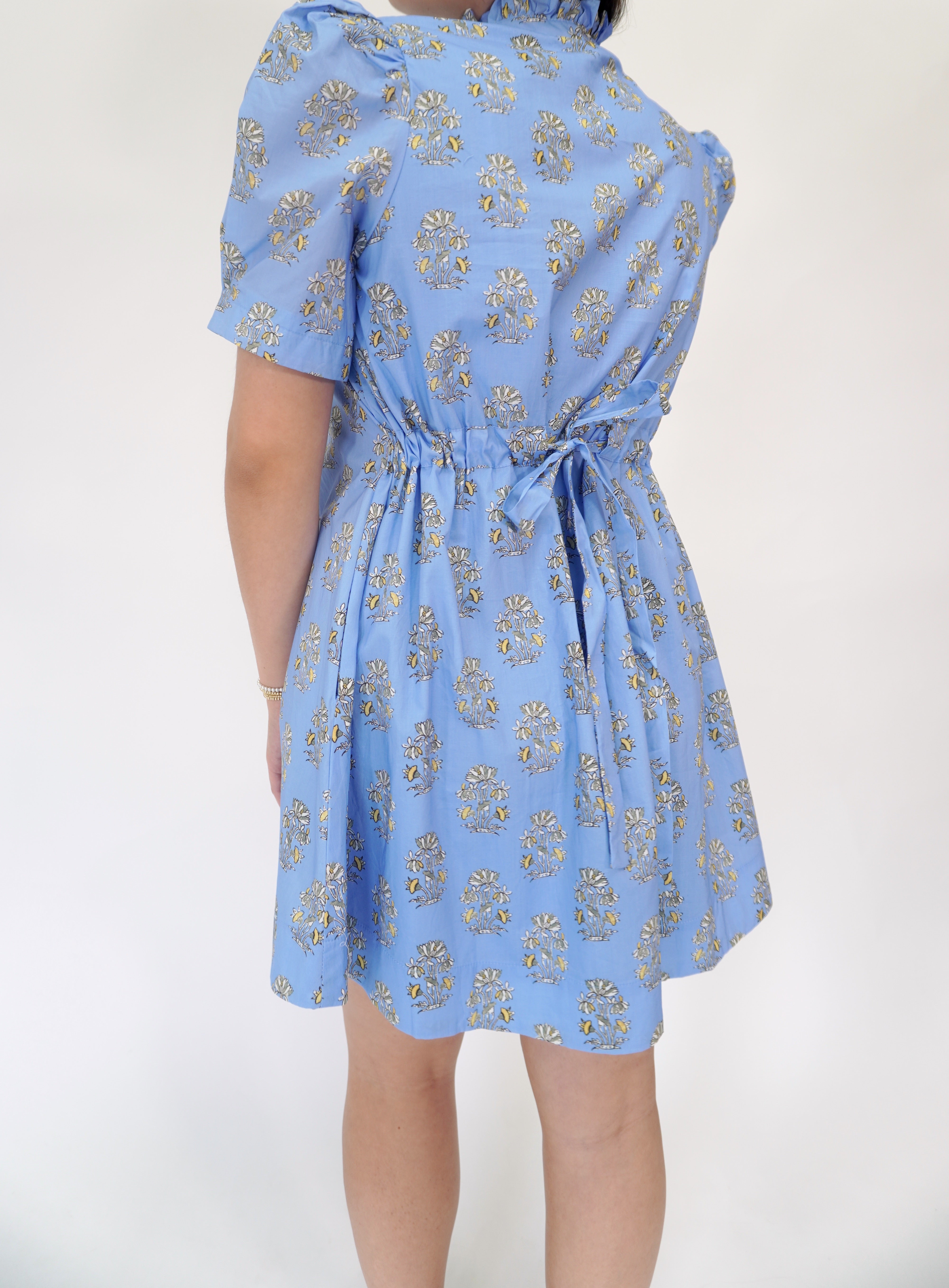 Light blue floral print mini dress with puff sleeves and classic button front styling