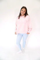 Pastel pink mock neck SALTY sweatshirt with ribbed cuffs and comfortable oversized fit.