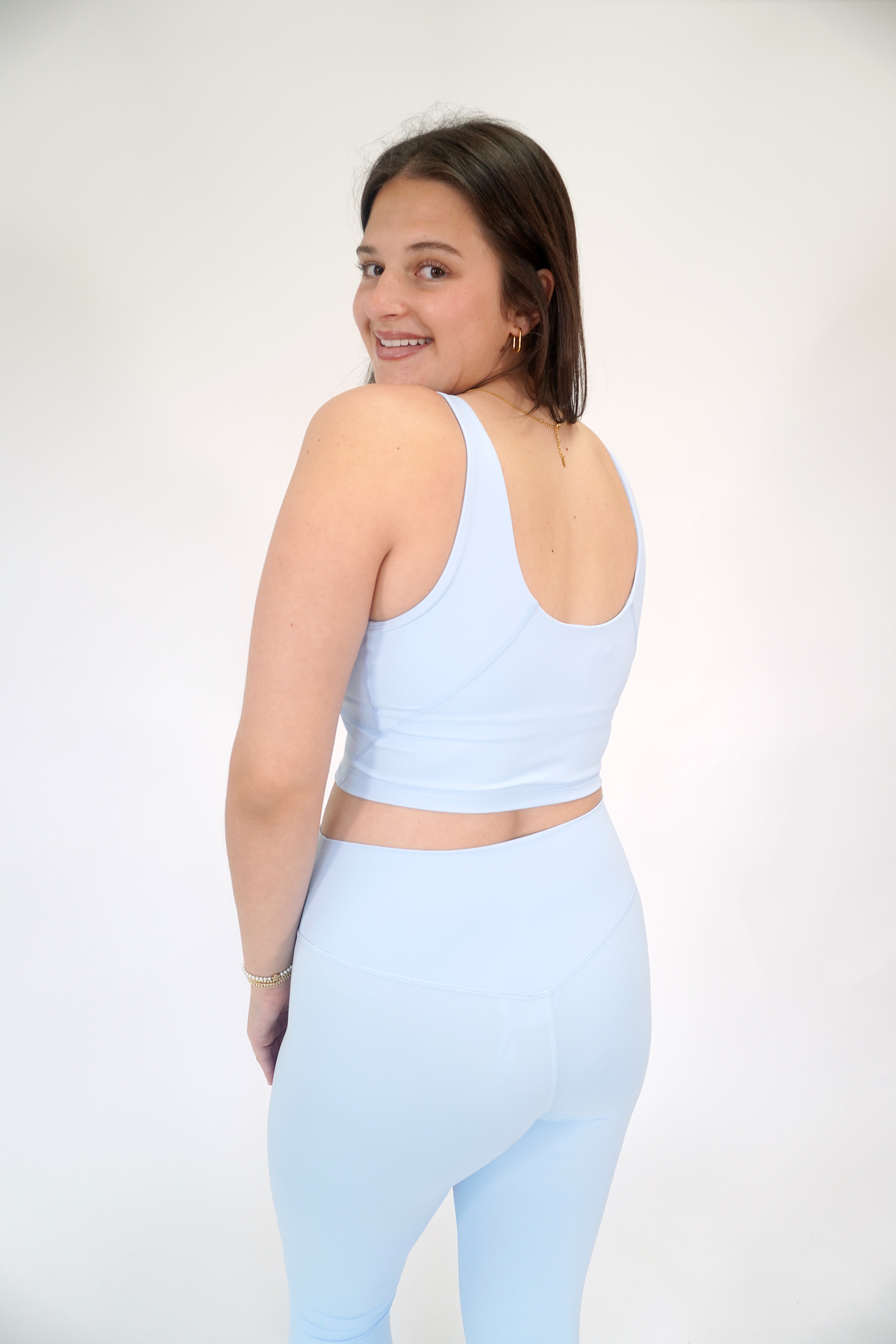 Light blue buttery soft yoga leggings with high-waisted support and flexible stretch.