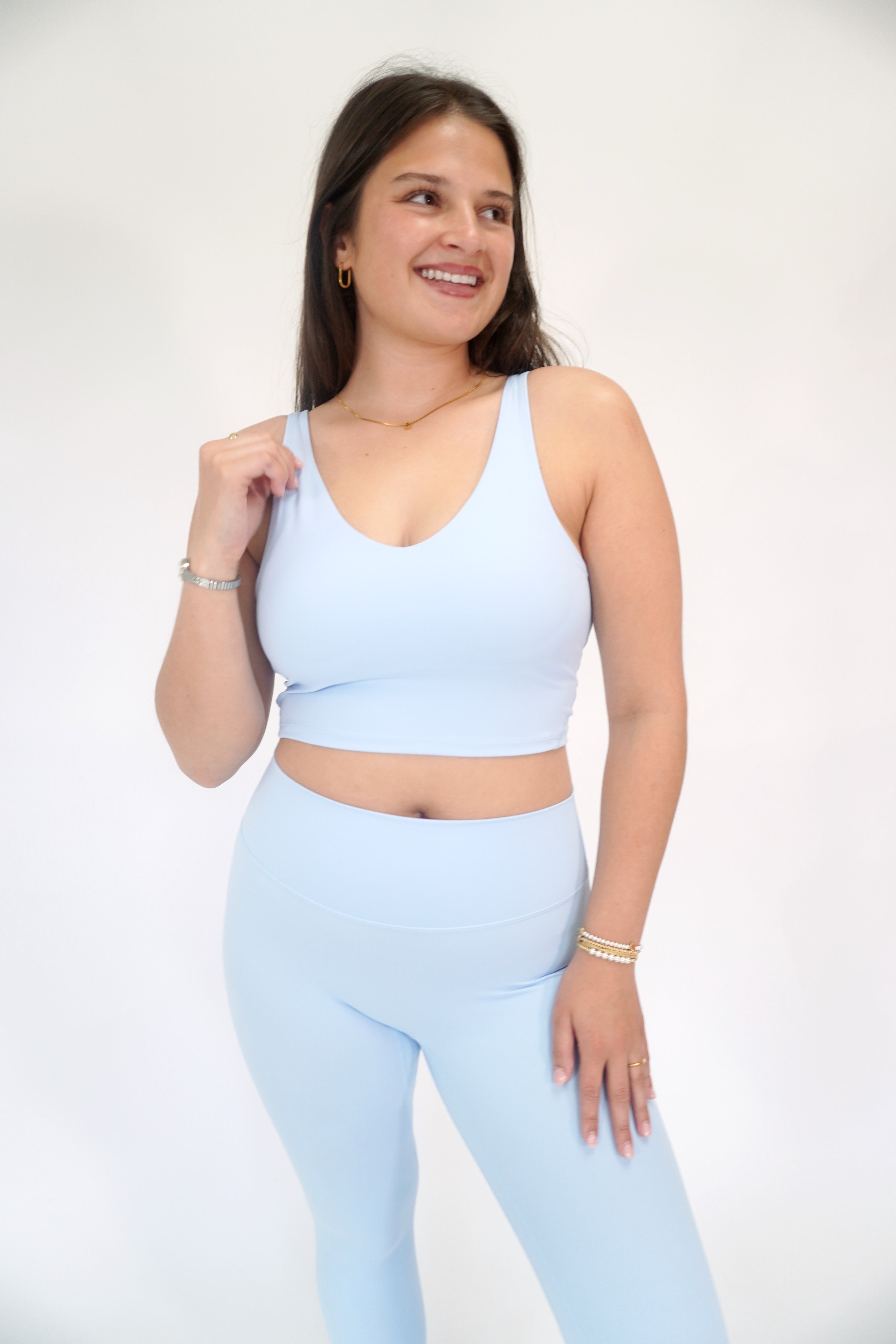 Light blue A-line athletic bra with buttery soft fabric and supportive stretch fit.