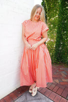 Coral and pink striped matching set with short sleeve top and flowy midi skirt