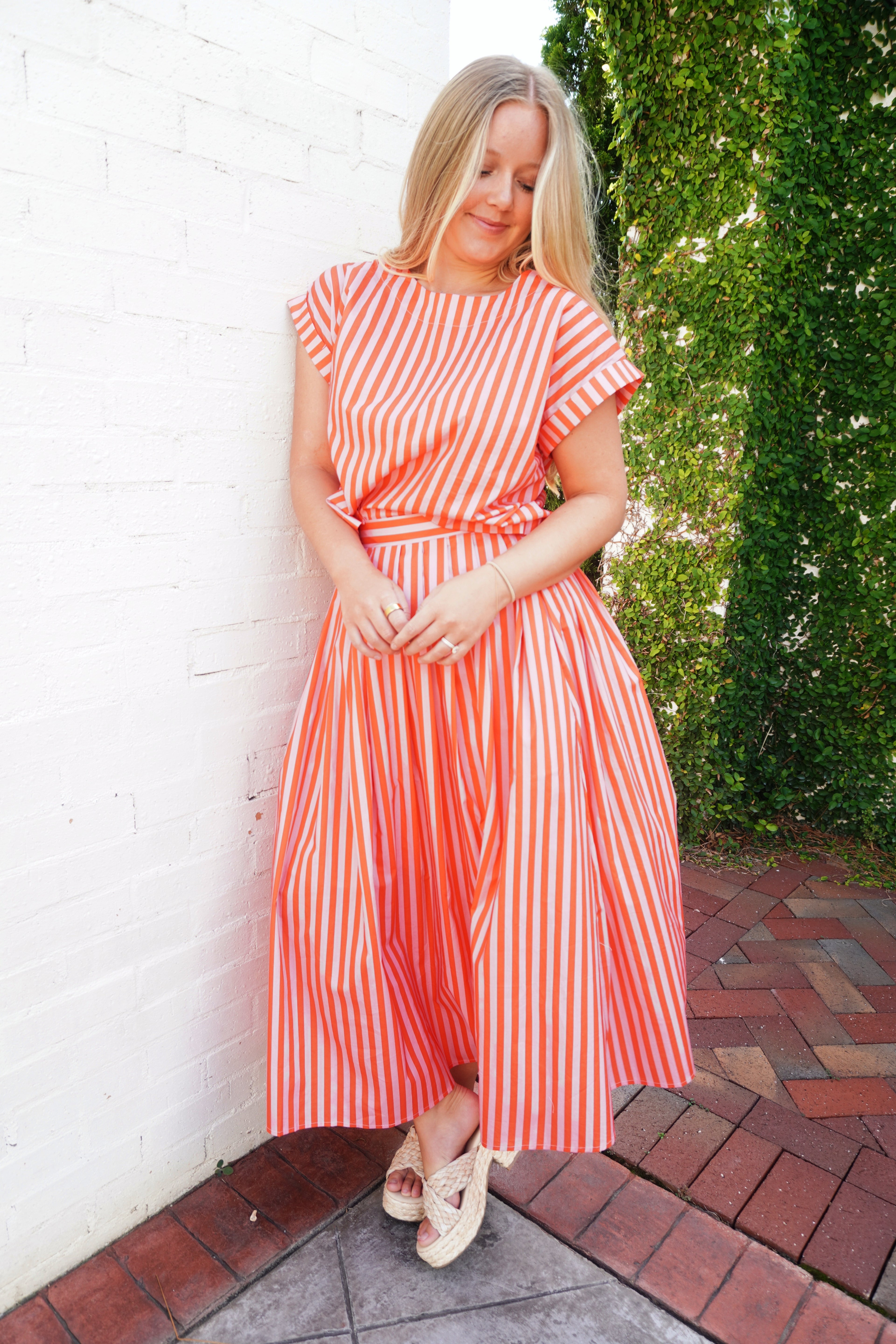 Coral and pink striped matching set with short sleeve top and flowy midi skirt