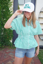 Women’s summer blouse with vertical green stripes, collar detail, and relaxed fit