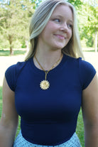 Fitted navy ribbed top styled with a light blue polka dot maxi skirt