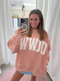 Blush WWJD faith-based mock neck sweatshirt styled casually