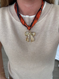 orange-navy-scarf-necklace-gold-bow-pendant.jpg
