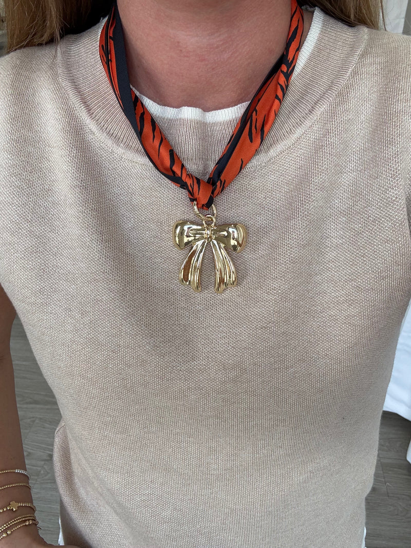orange-navy-scarf-necklace-gold-bow-pendant.jpg