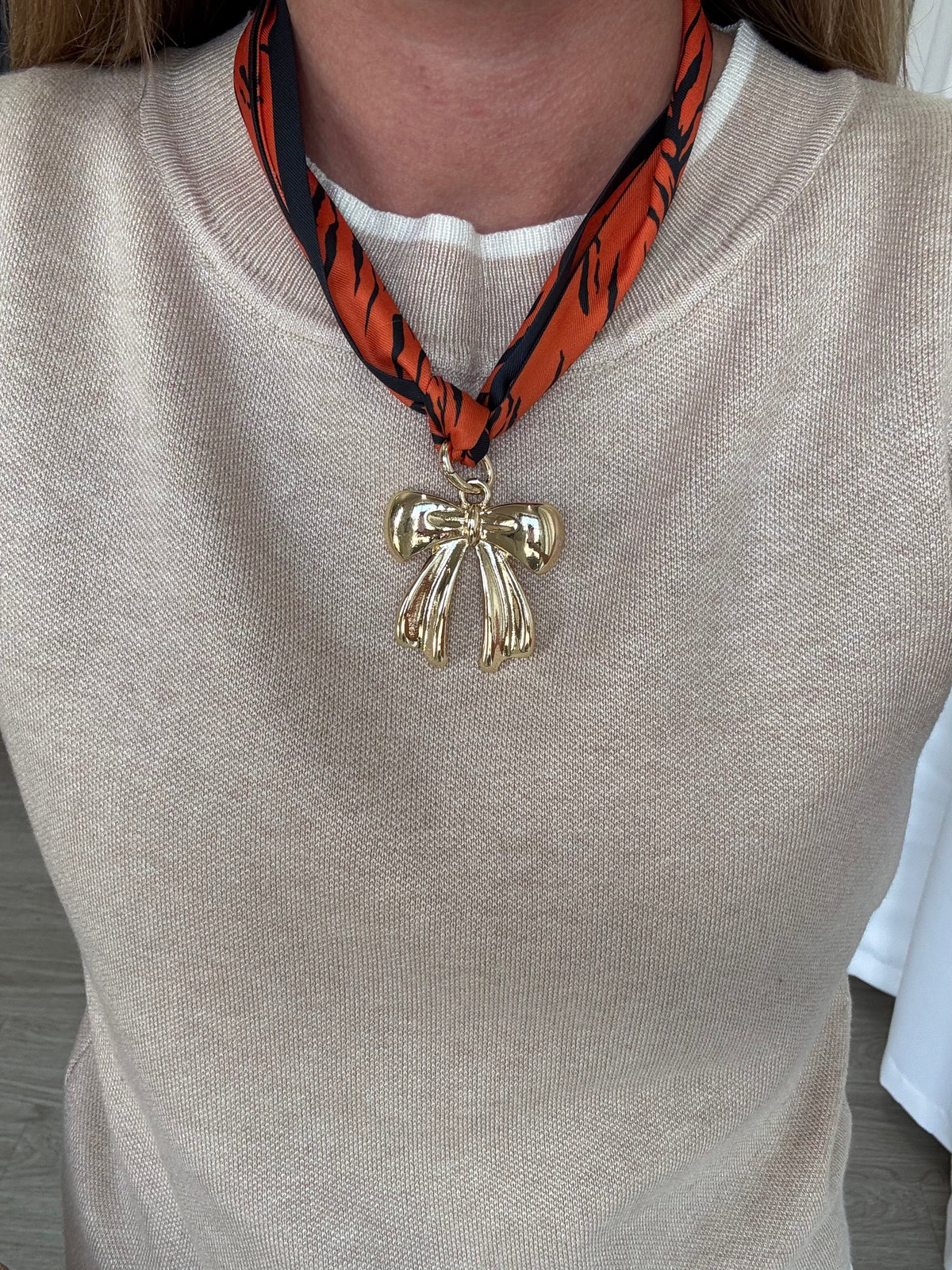 orange-navy-patterned-scarf-with-bow-charm.jpg