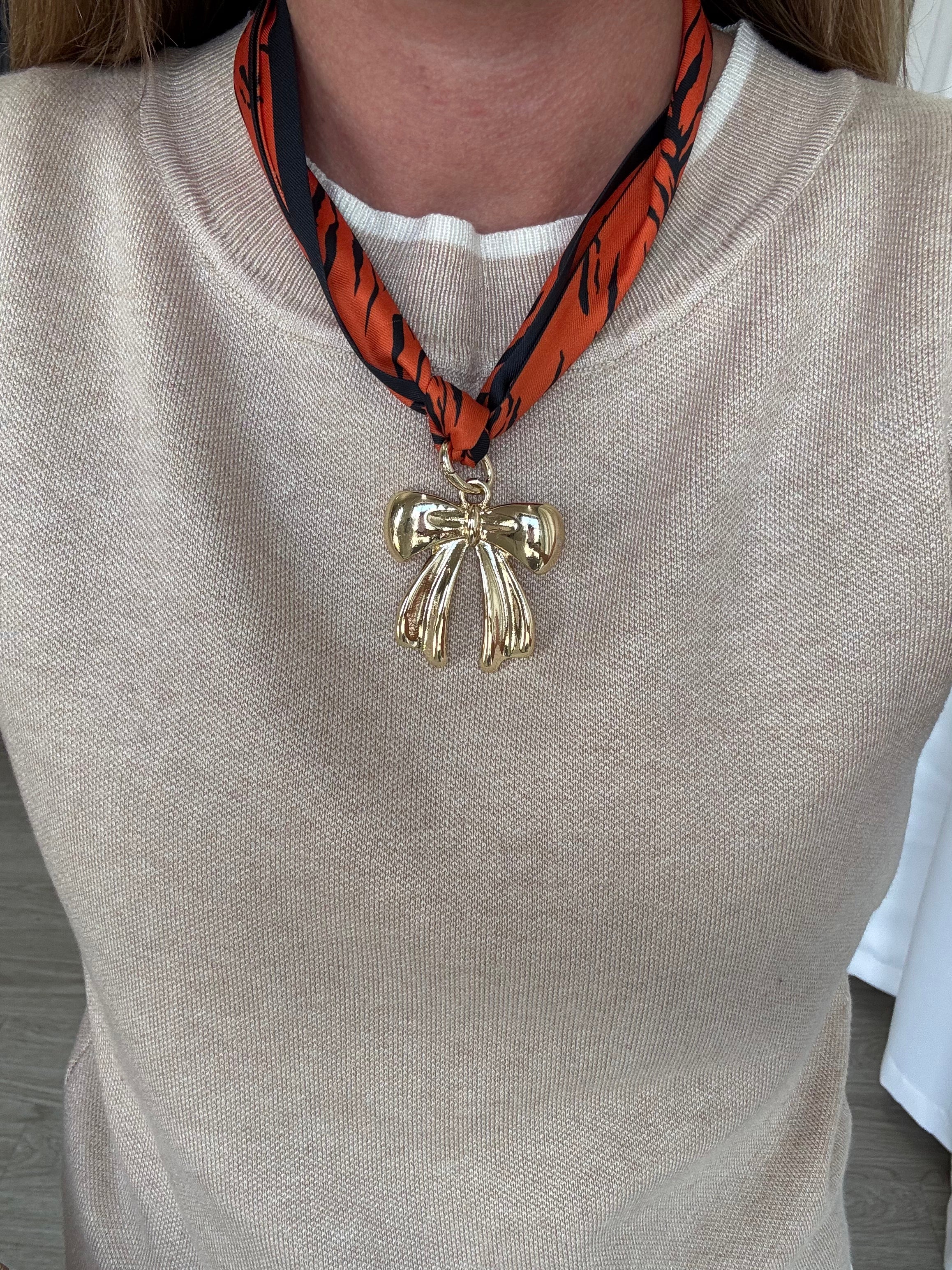orange-navy-patterned-scarf-with-bow-charm.jpg