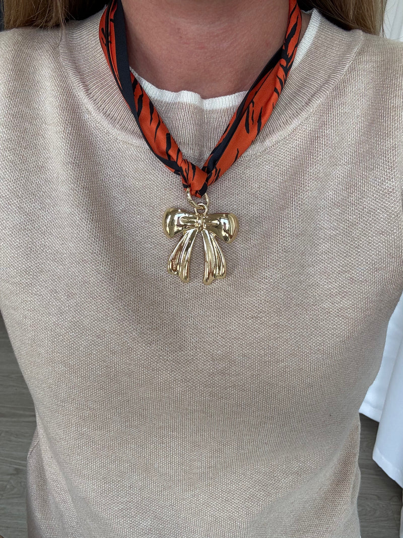 orange-navy-patterned-scarf-with-bow-charm.jpg