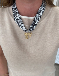 black-white-scarf-necklace-gold-bow-pendant.jpg
