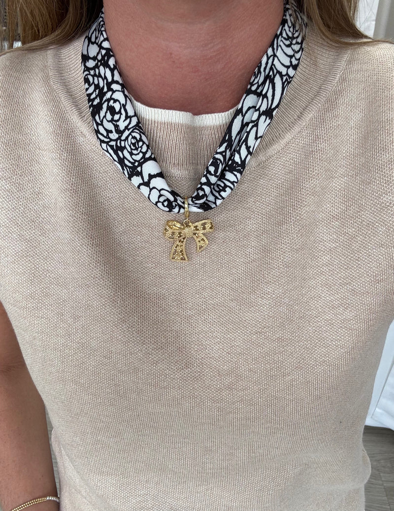 black-white-scarf-necklace-gold-bow-pendant.jpg