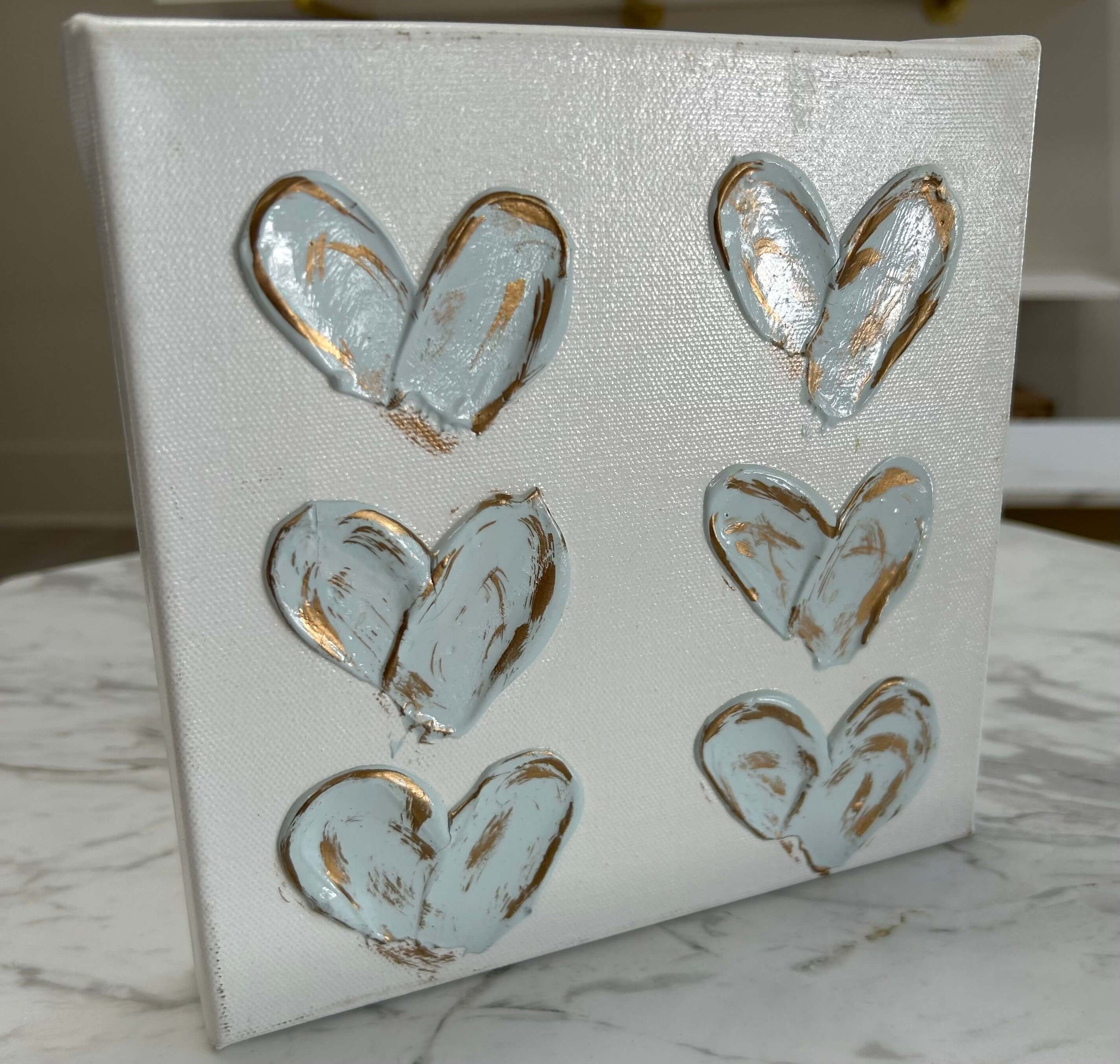 White and blue and gold painted hearts