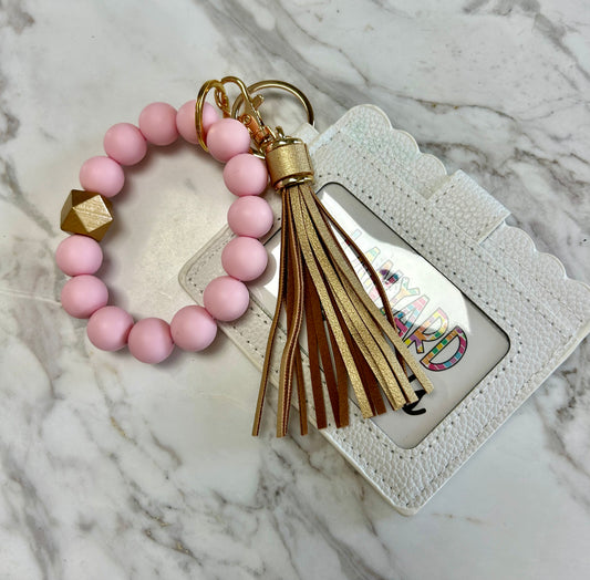 Solid light pink wristlet keychain with white wallet