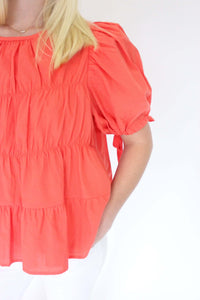 Sunset Breeze Tiered Babydoll Top - Coral Orange product on sleeve