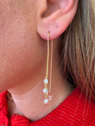 claire-gold-pearl-drop-earrings-closeup-1.jpg