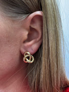 noelle-gold-interlocking-knot-earrings-model-1.jpg