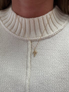 haven-gold-beaded-cross-necklace-model-1.jpg