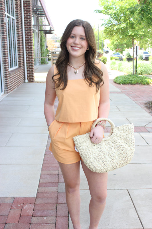 casual-peach-romper-woven-bag-style.jpg