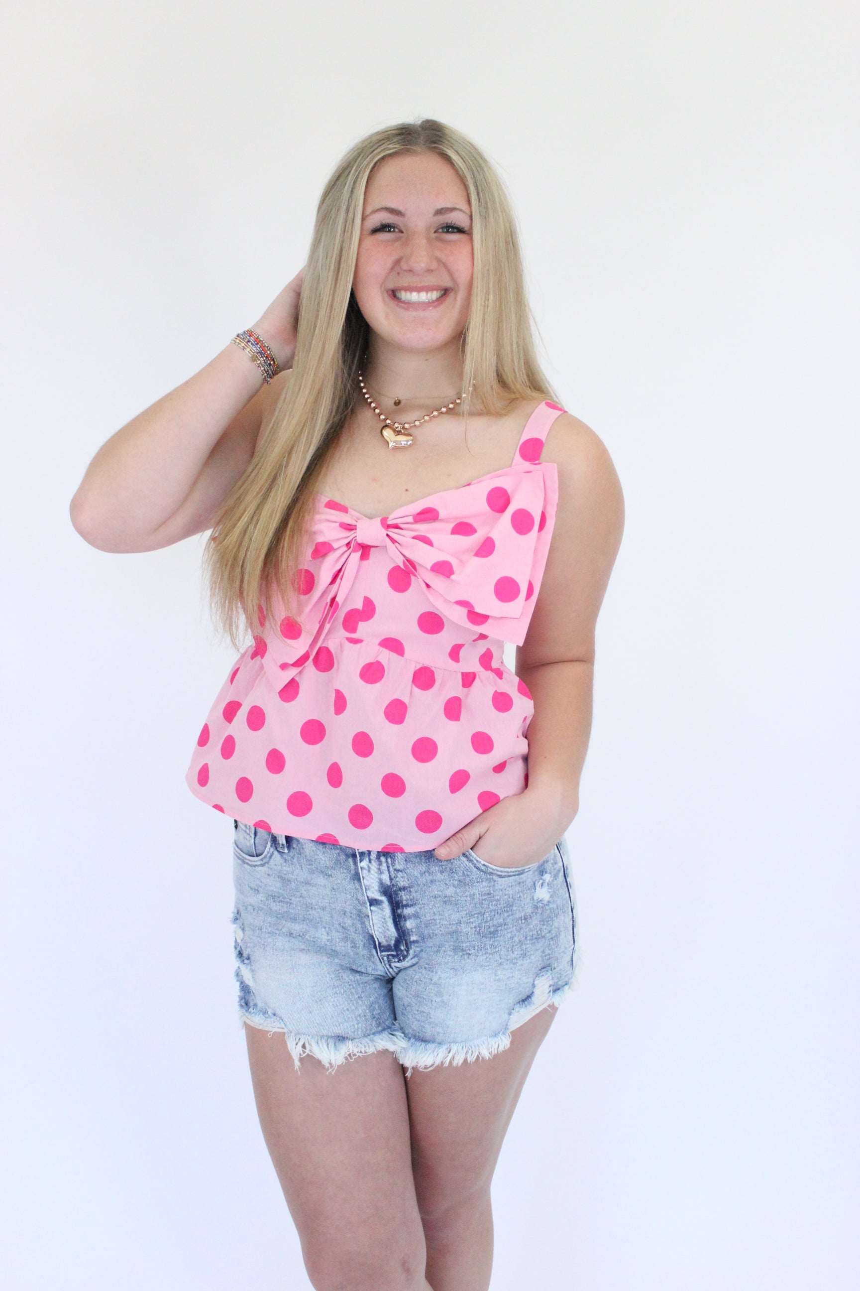 Pretty in Pink One-Shoulder Ruffle Top hand in hair