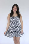 Bloom Black & White Floral A-Line Mini Dress hand on dress