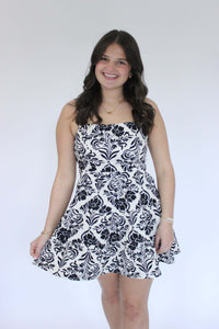 Bloom Black & White Floral A-Line Mini Dress hand on dress