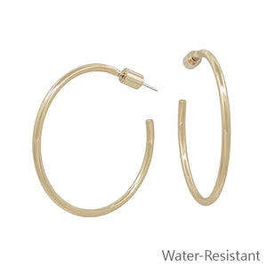 Gold hoop earrings on a white background