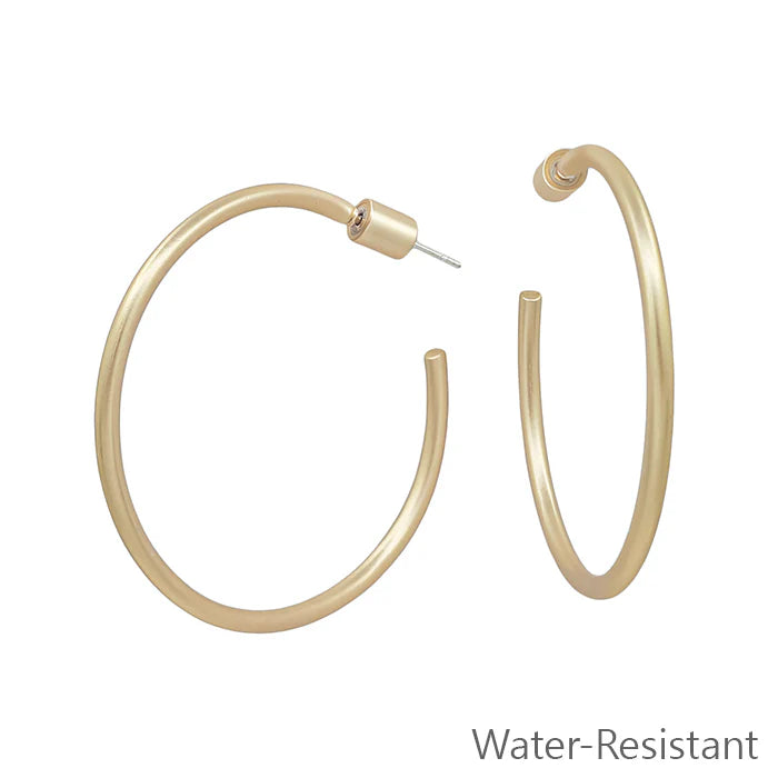 Gold hoop earrings on a white background with 'Water-Resistant' text.