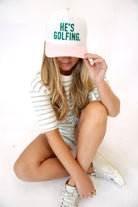 “He’s Golfing” Embroidered Pink & White Baseball Cap - Anderson Ave boutique