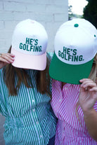 “He’s Golfing” Embroidered Pink & White Baseball Cap - Anderson Ave boutique