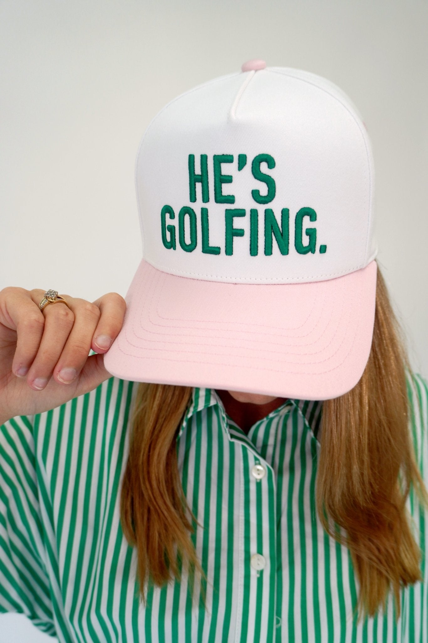 “He’s Golfing” Embroidered Pink & White Baseball Cap - Anderson Ave boutique