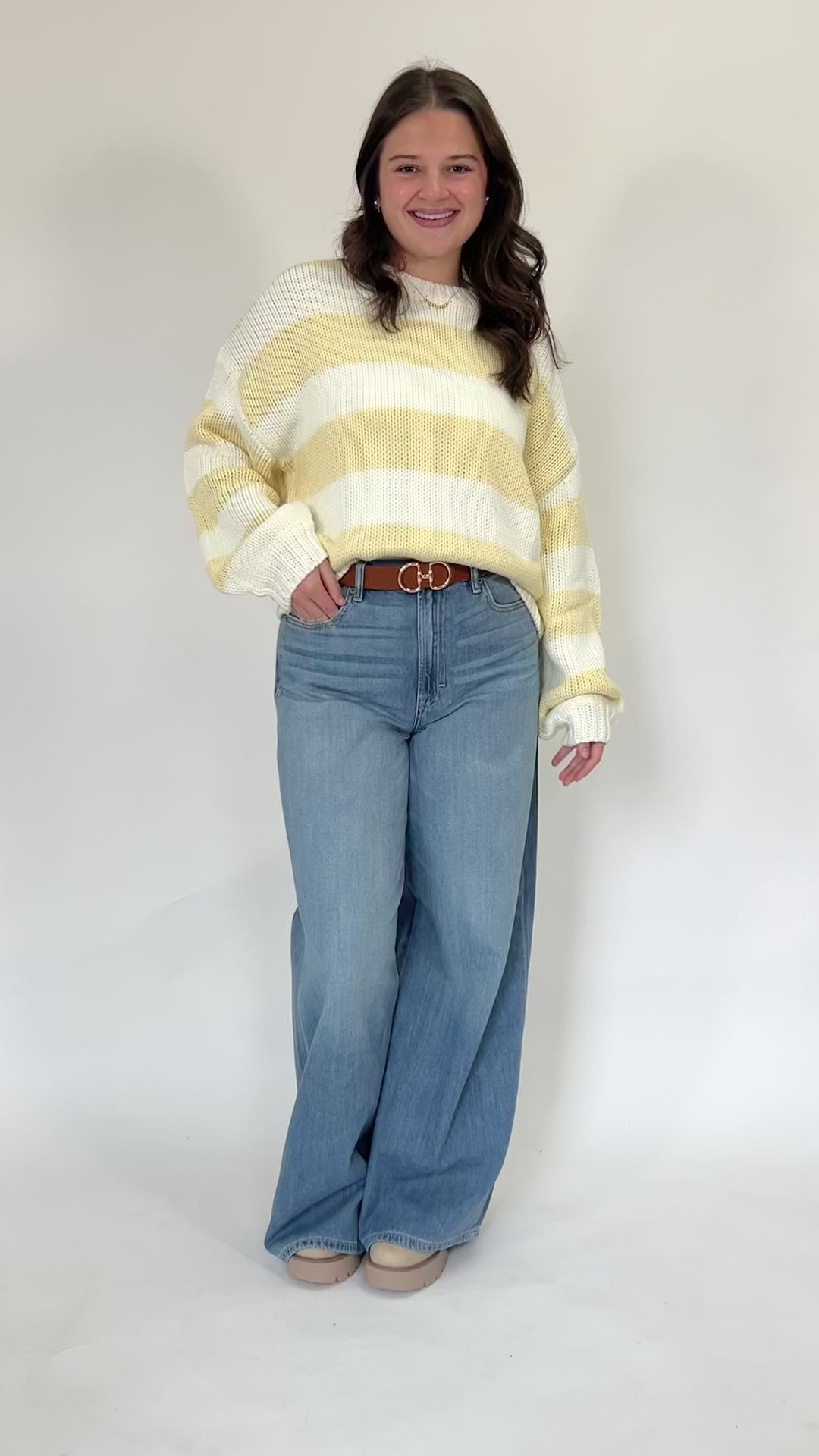 Textured knit striped sweater paired with high waisted jeans for casual outfit