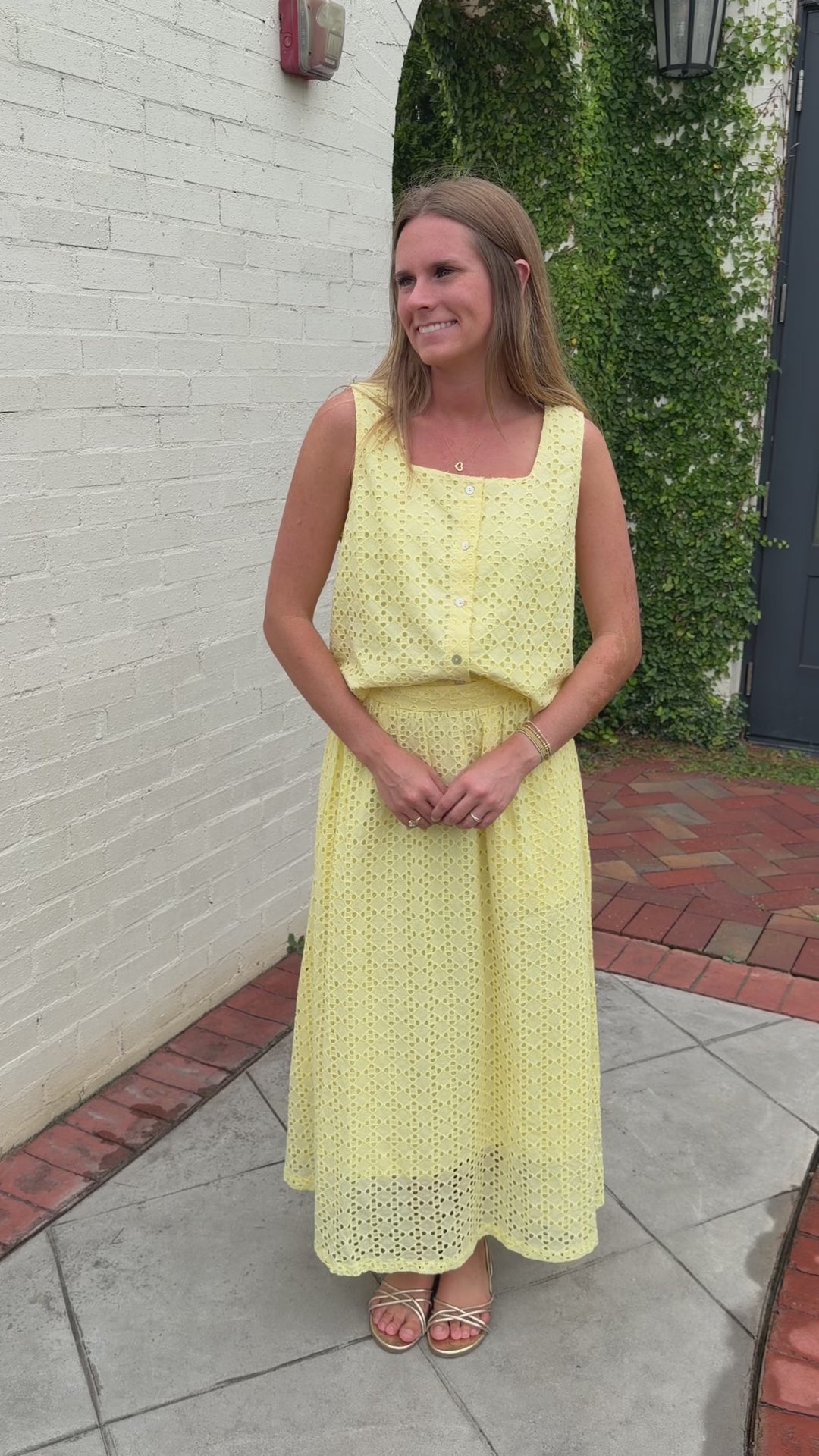 Lightweight butter yellow eyelet top styled with matching skirt for an elevated summer boutique outfit.