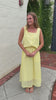 Lightweight butter yellow eyelet top styled with matching skirt for an elevated summer boutique outfit.