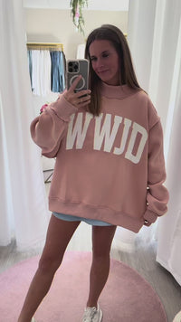 Oversized blush pink WWJD sweatshirt with white lettering