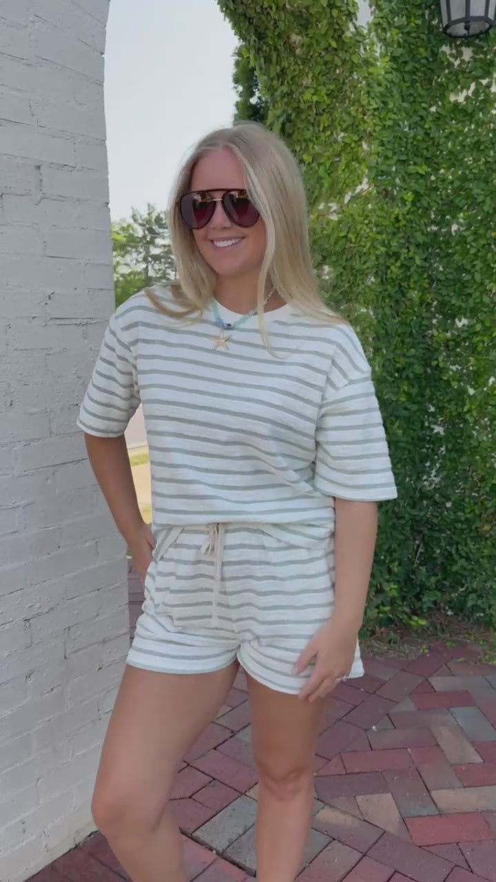 Lightweight green striped terry cloth set styled with white sandals for an easy everyday look