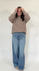 Oversized pink WWJD sweatshirt with ribbed cuffs and cozy fleece feel