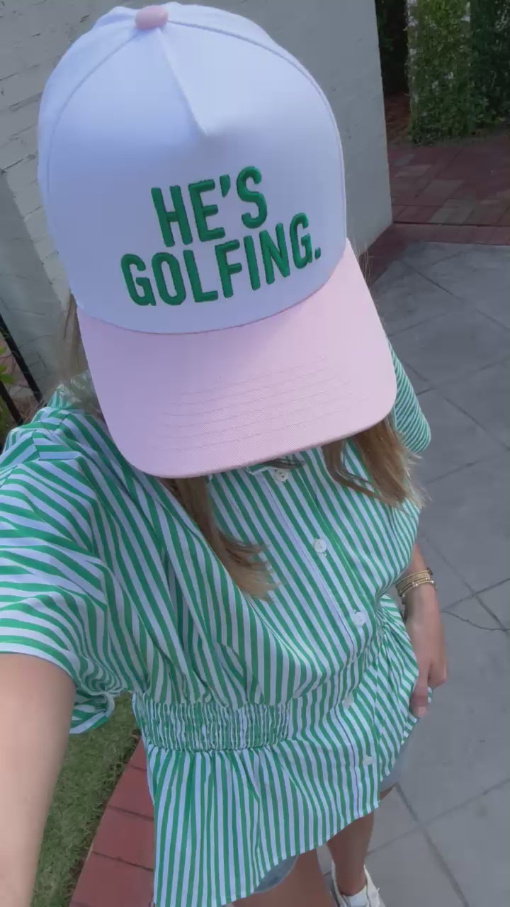 Casual southern style outfit featuring striped set and “He’s Golfing” graphic hat
